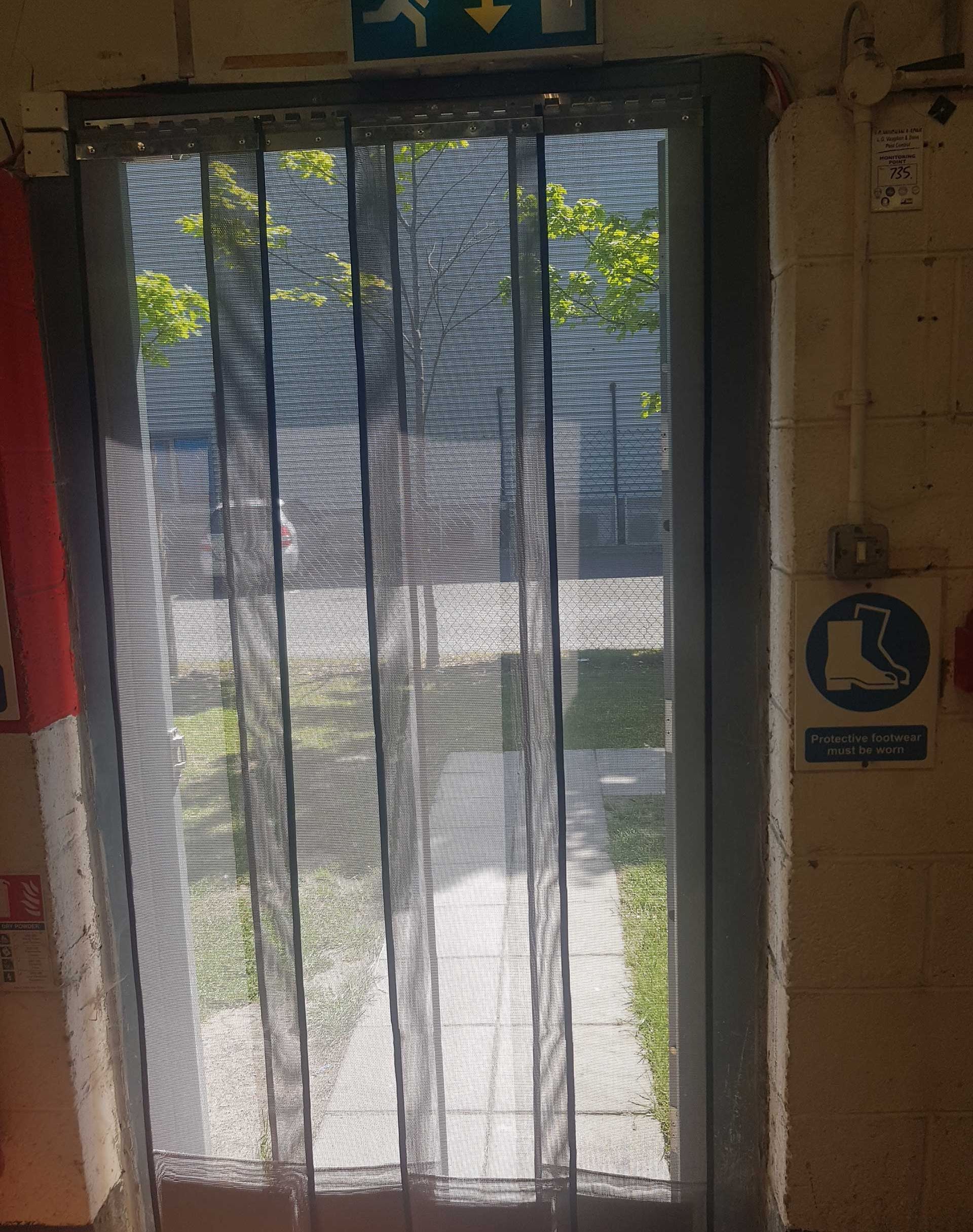 fly screens installed in a doorway