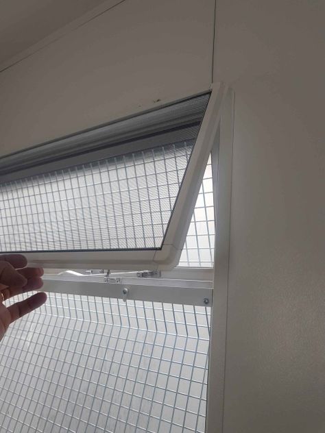 fly screen installed on the inside of a window frame