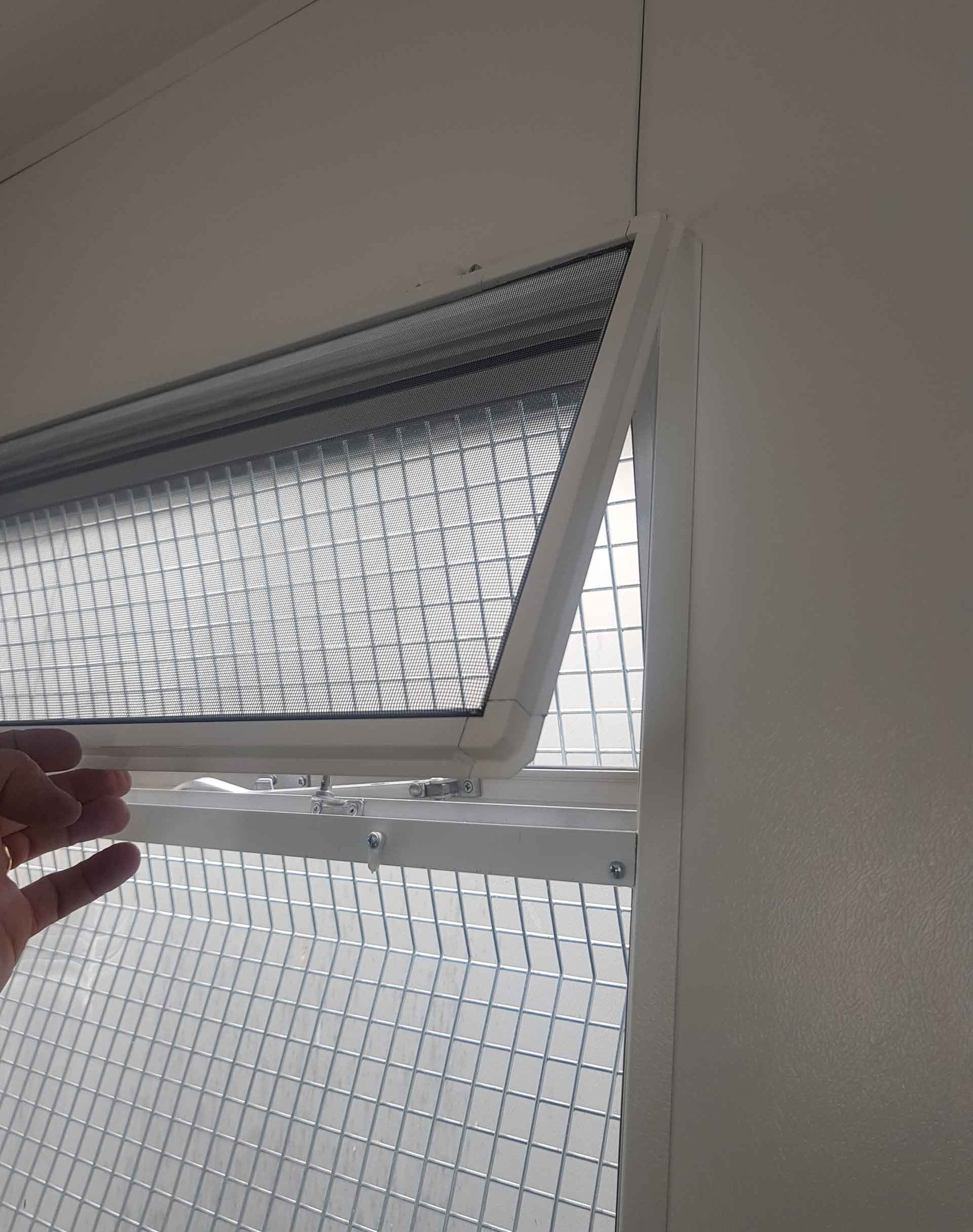 fly screen installed on the inside of a window frame